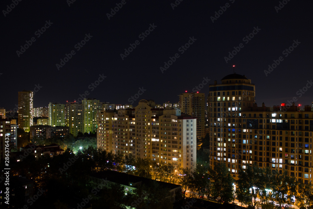panorama of the night city with modern residential buildings in Moscow Russia