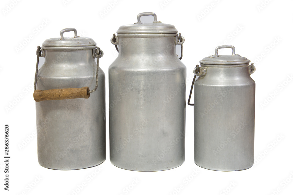 three retro aluminium milk cans on white background three retro aluminium milk cans on white background