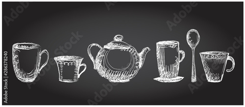 Tea utensils graphic set on a chalkboard, hand drawn sketch symbols