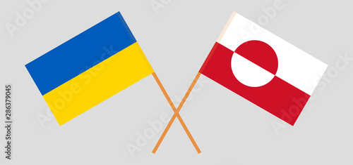 Greenland and Ukraine. Crossed Greenlandic and Ukrainian flags