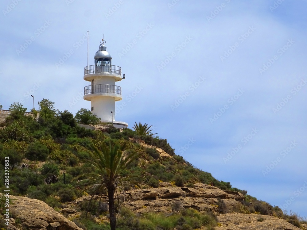 Lighthouse of Cabo de San Juan on the coast of Alicante on a sunny summer day