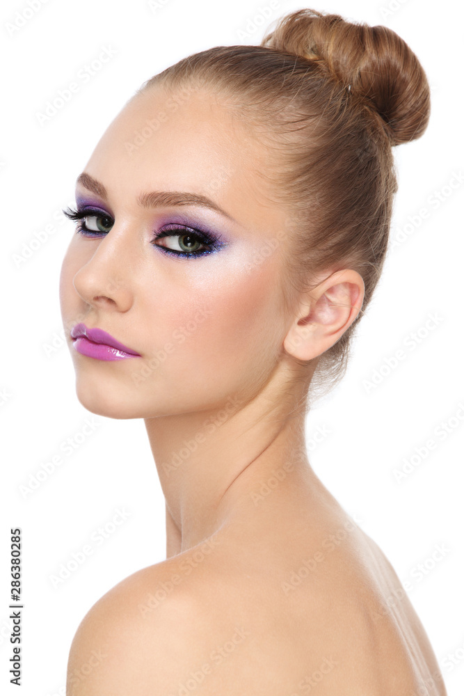 Young beautiful girl with fancy makeup and hair bun Young beautiful girl with fancy makeup and hair bun