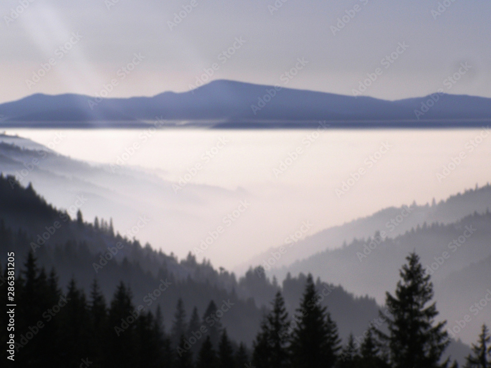 landscape with fog in the valleys