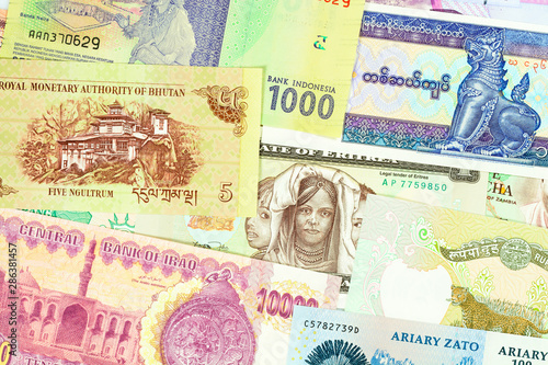 Old paper banknotes from exotic countries of Asia and Africa. Colorful money background 2. Close up high resolution.
