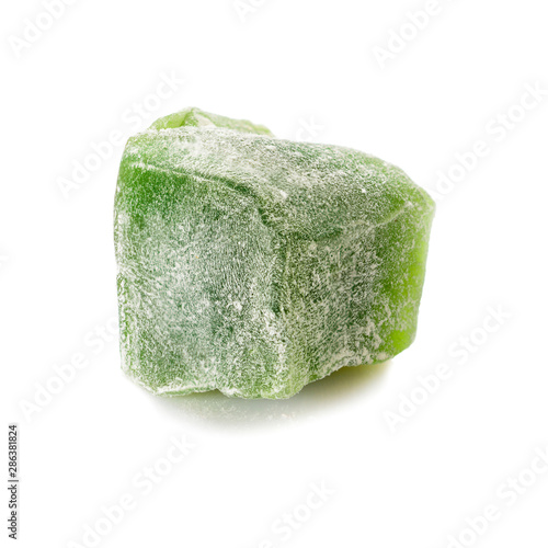 Turkish delight. Mint rahat locum, one piece of sweet oriental delights in powered sugar. Close-up view.