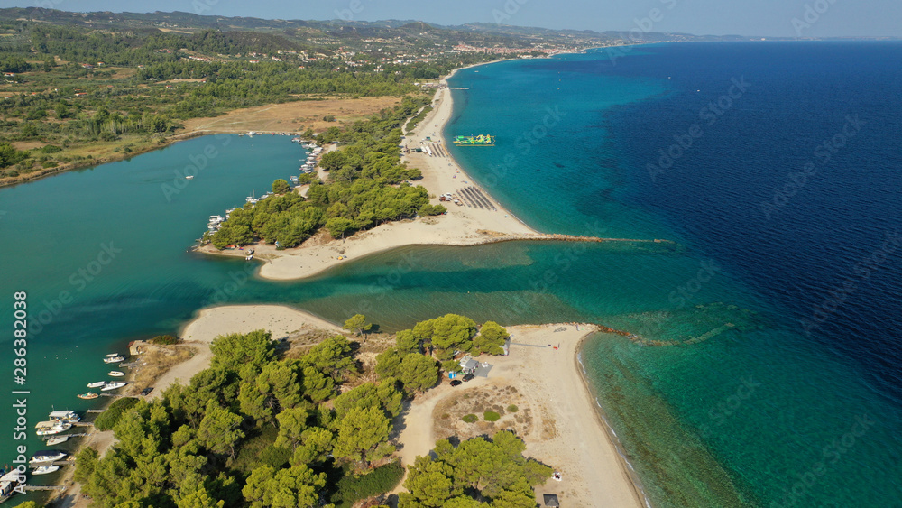 Aerial drone view of iconic sandy bay and turquoise beach of Galrokavos in Kassandra Peninsula, Halkidiki, North Greece