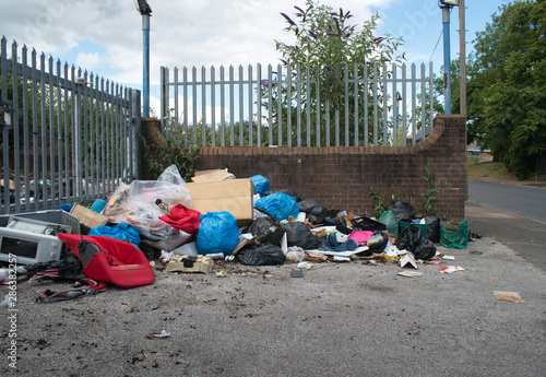 Fly tipping in urban street, West Midlands, UK