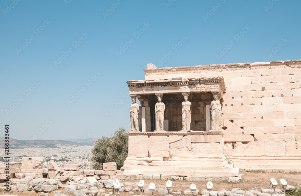 The Erechtheion is an ancient Greek temple on the north side of the Acropolis of Athens in Greece which was dedicate to both Athena and Poseidon.