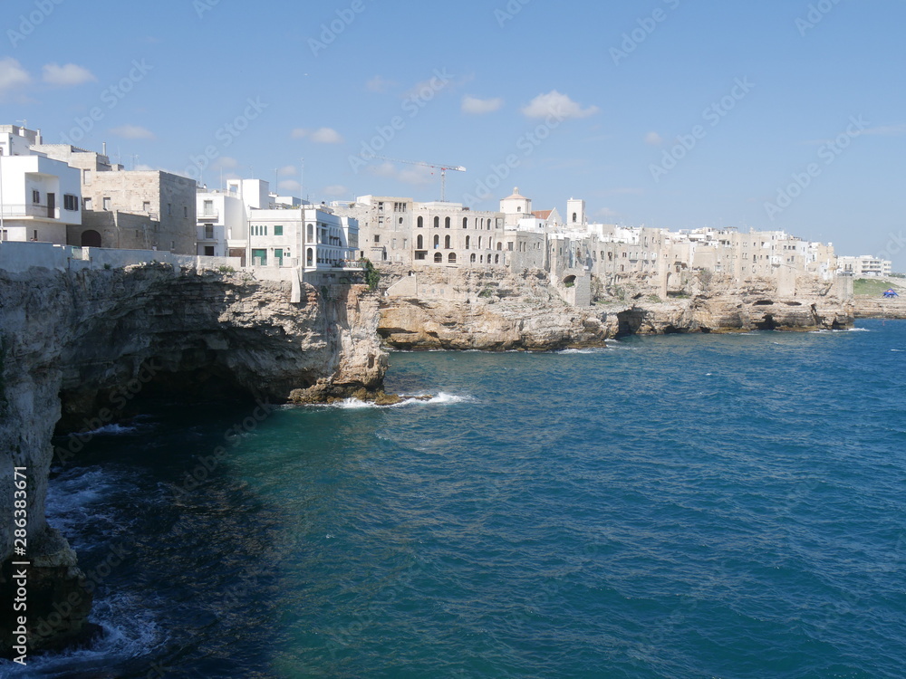 Polignano, seafront :  Medieval touristic city in Apulia, Italy built on a rocky ridge overlooking the Adriatic Sea and famous for the singer Modugno and for the event Red Bull cliff diving.