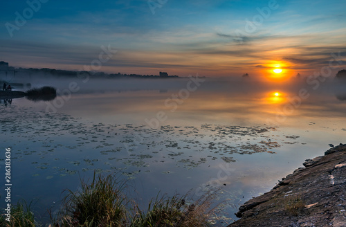 Sunrise with the mist above a river, summer morning in Jurmala - famous tourist resort in Latvia