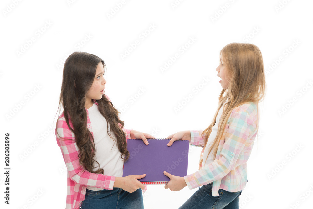 They need help with homework. Naughty schoolgirls in school homework club. Little school children fighting over homework assignment. Small pupils cant share homework diary and record book among them