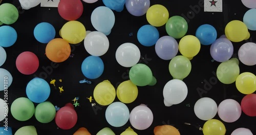 Carnival balloon dart game at fair. Shot in 4K RAW on a cinema camera. photo