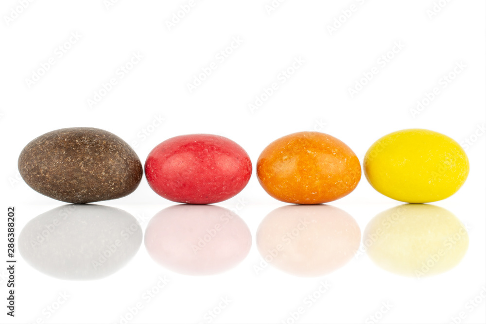 Group of four whole sugared nut dragee isolated on white background Group of four whole sugared nut dragee isolated on white background