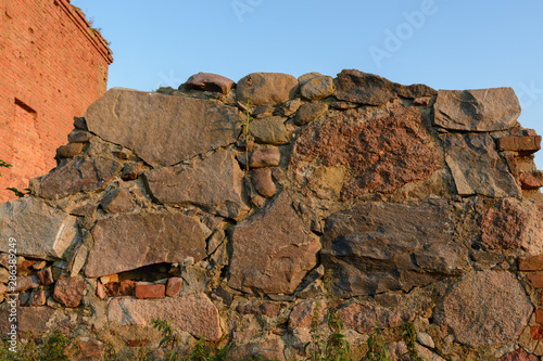 The building of the first manufactory stands on the outskirts of the village in the field.The building is red brick and stone. Ancient building in Belarus. Sights of Belarus.Sights of the Brest region