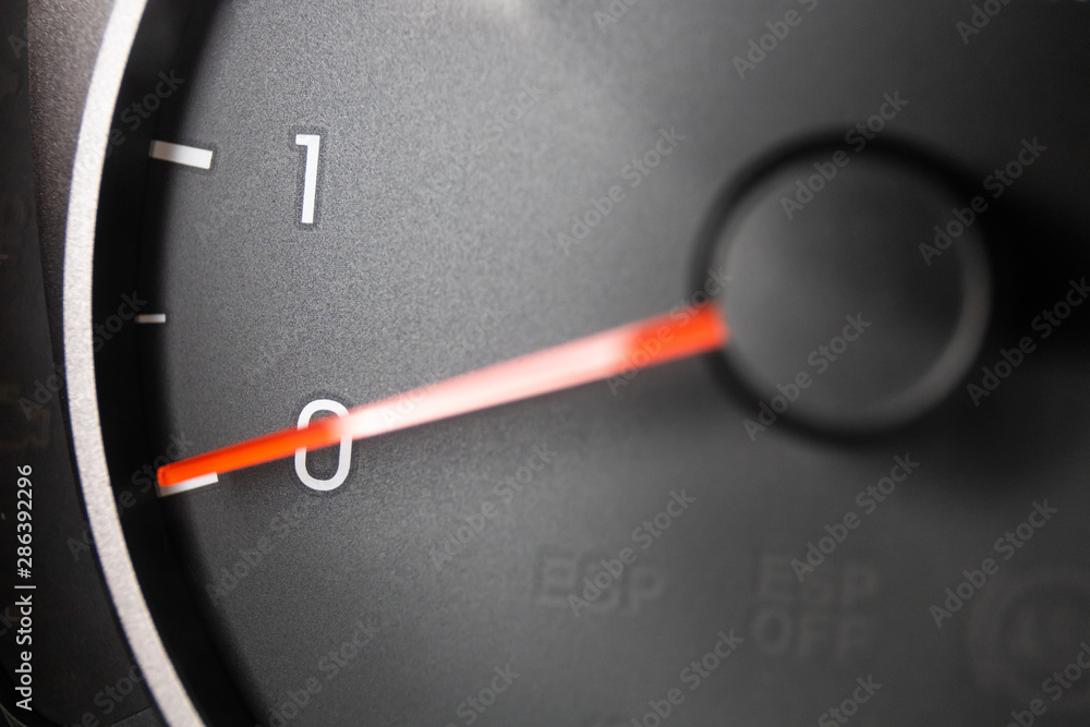 Naklejka premium tachometer pointer on car dashboard