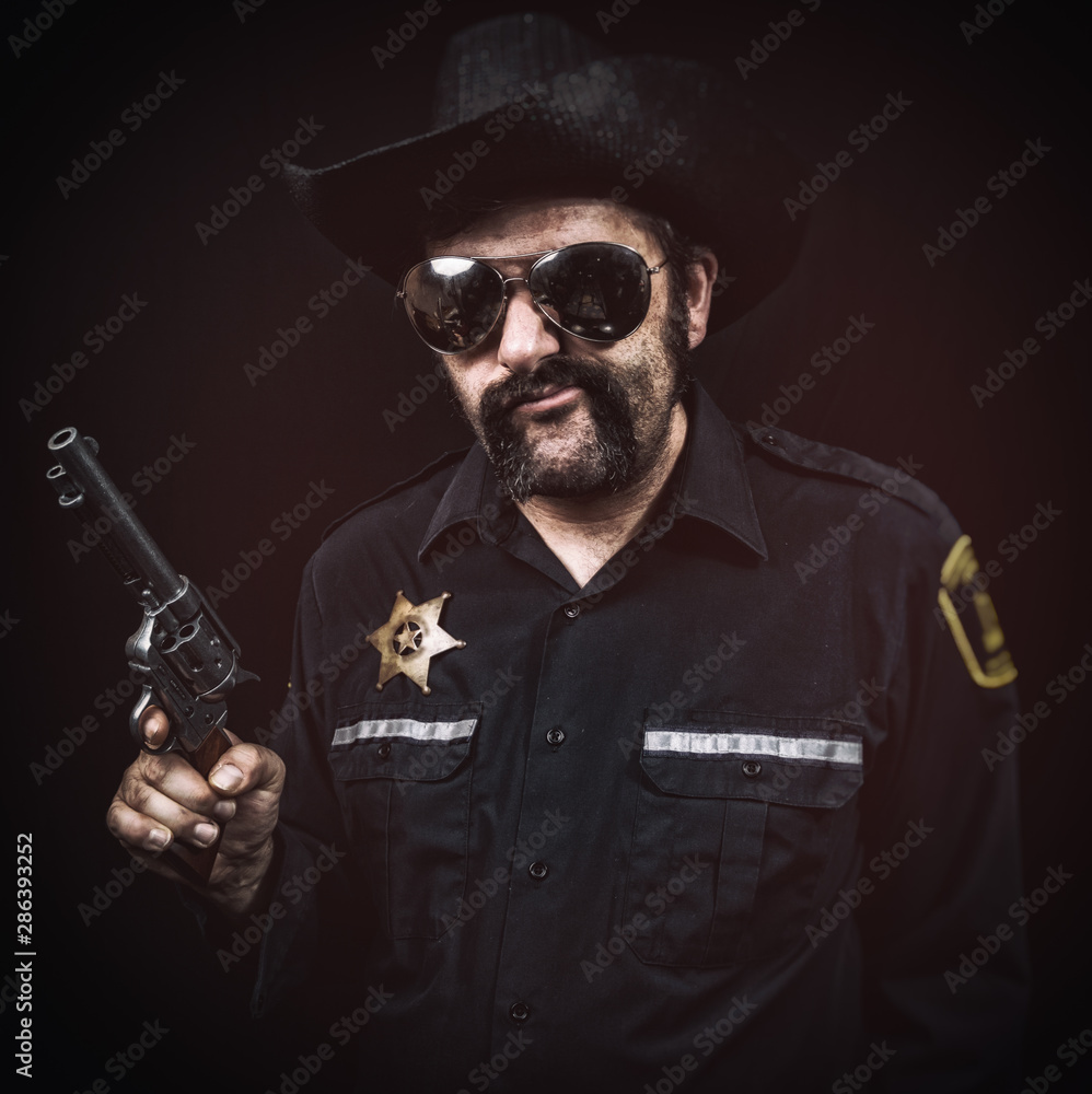 Sleazy southern style sheriff cop smirking or chewing tobacco with a