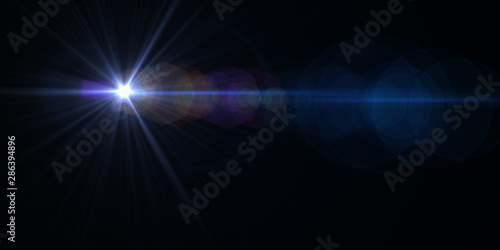 Lens flare light over black background. Easy to add overlay or screen filter over photos.