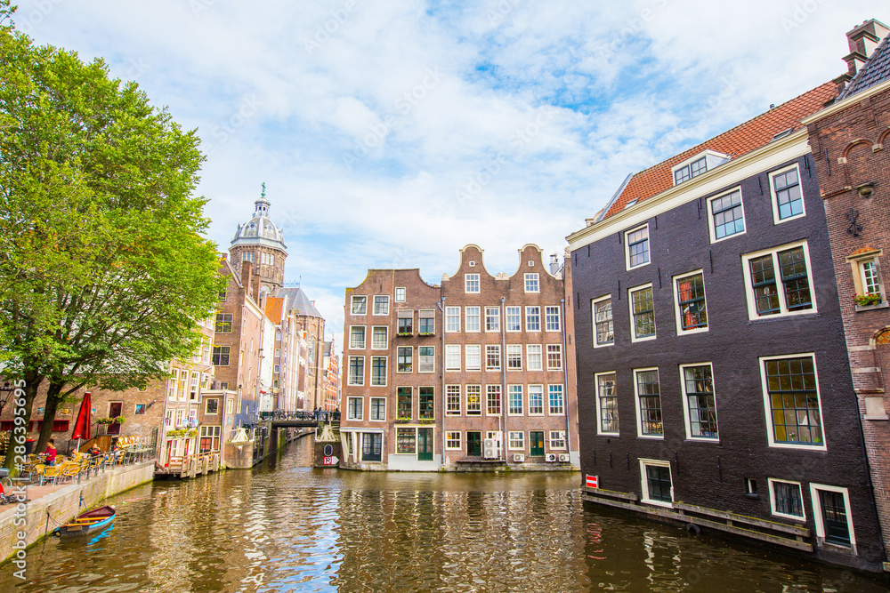 Beautiful Amsterdam canals with typical houses