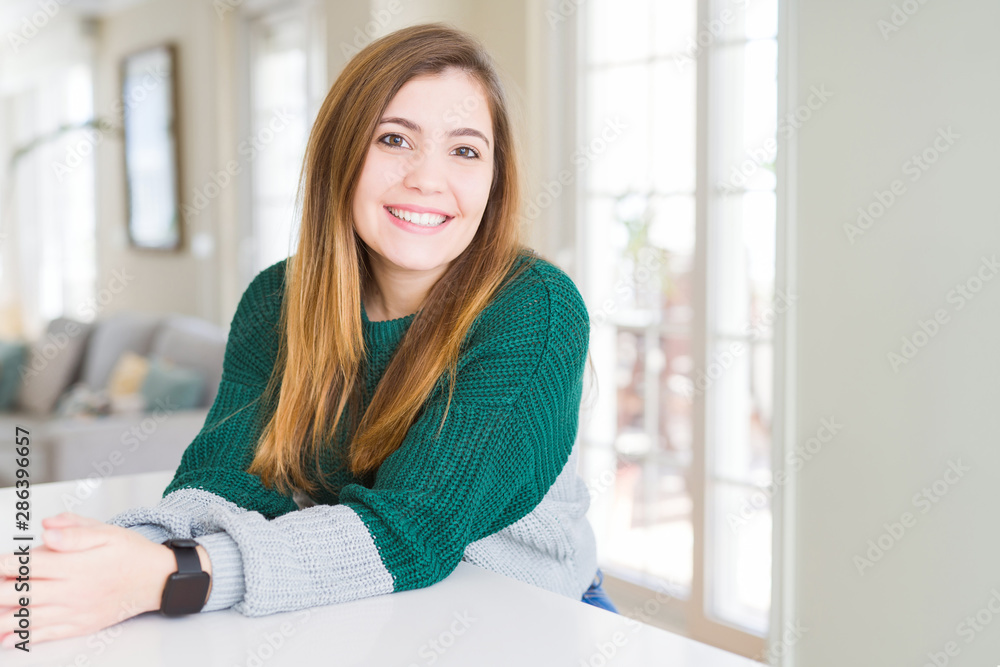 Fototapeta premium Beautiful young woman smiling confident to the camera
