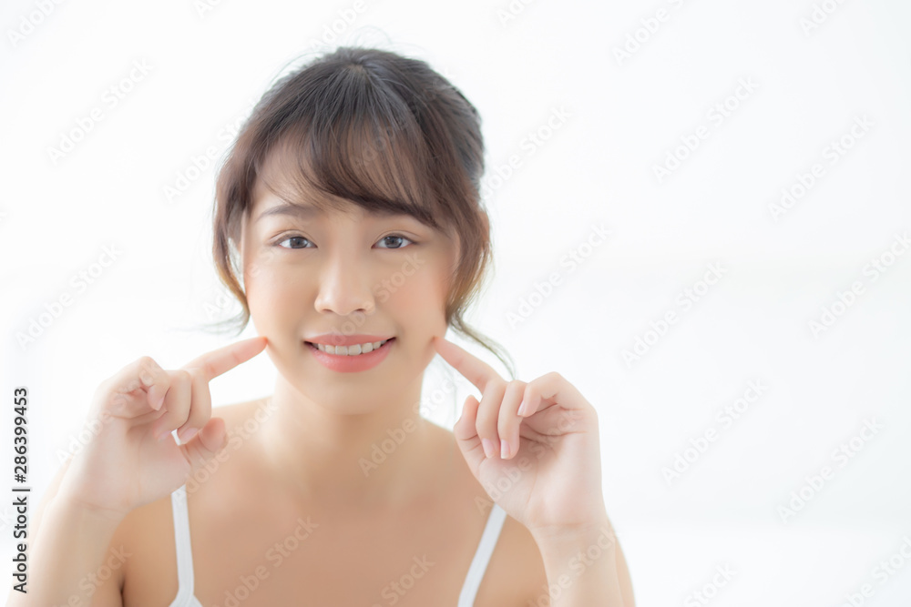 Portrait beautiful asian woman makeup of cosmetic, girl hand touch cheek and smile attractive, face beauty perfect with wellness in the bedroom at home with skin care and healthcare concept. Portrait beautiful asian woman makeup of cosmetic, girl hand touch cheek and smile attractive, face beauty perfect with wellness in the bedroom at home with skin care and healthcare concept.