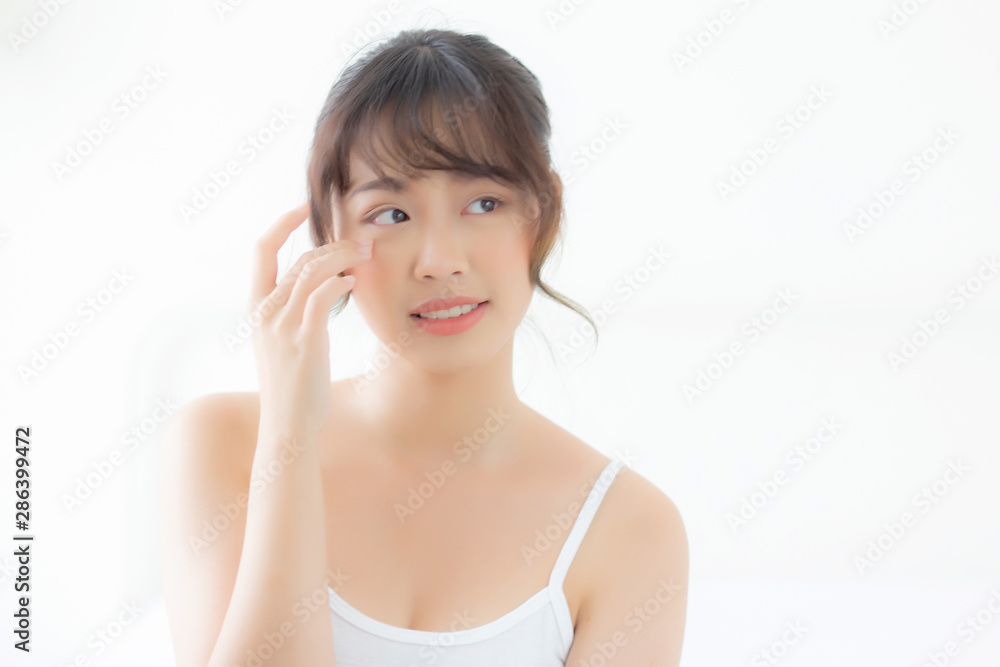 Portrait of beautiful young asian woman smile healthy and wellness at the bedroom, beauty asia girl skin care touch eye makeup and cosmetic with happy with fresh, lifestyle and relax concept. Portrait of beautiful young asian woman smile healthy and wellness at the bedroom, beauty asia girl skin care touch eye makeup and cosmetic with happy with fresh, lifestyle and relax concept.