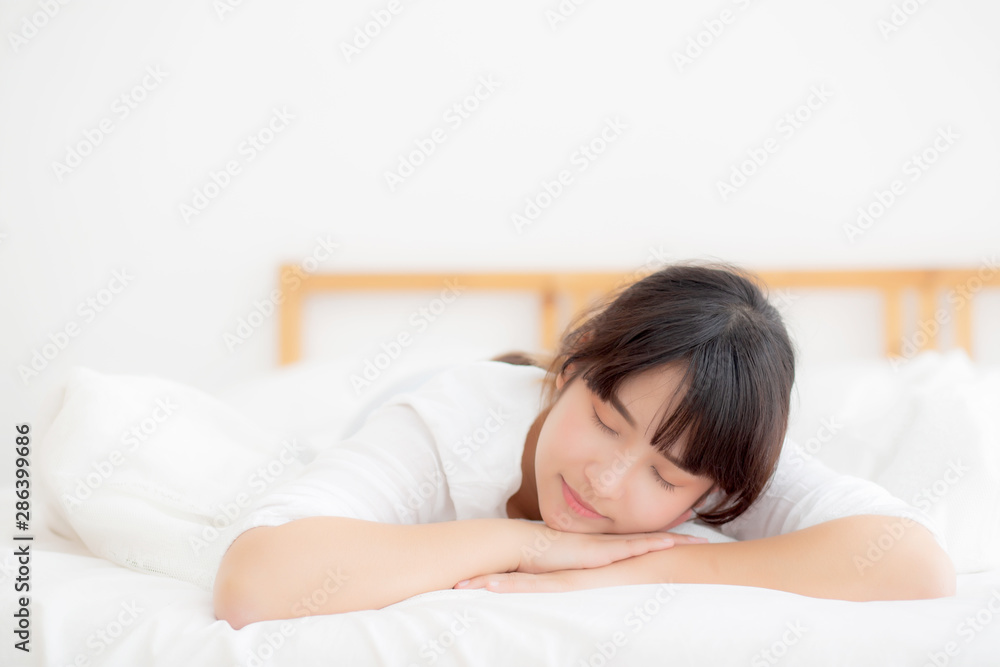 Beautiful asian young woman tired sleeping lying in bed comfortable and happy, girl with relax and leisure in the bedroom, health and wellness concept. Beautiful asian young woman tired sleeping lying in bed comfortable and happy, girl with relax and leisure in the bedroom, health and wellness concept.