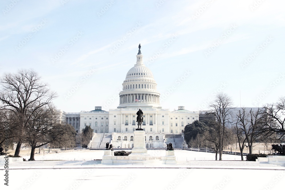 The US Capitol Building in Washington DC on a sunny winter day after a heavy snow with no people. The US Capitol Building in Washington DC on a sunny winter day after a heavy snow with no people.