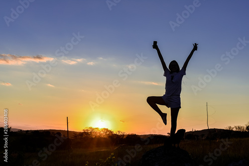Wallpaper Mural Silhouette girl playing in the sun. Torontodigital.ca