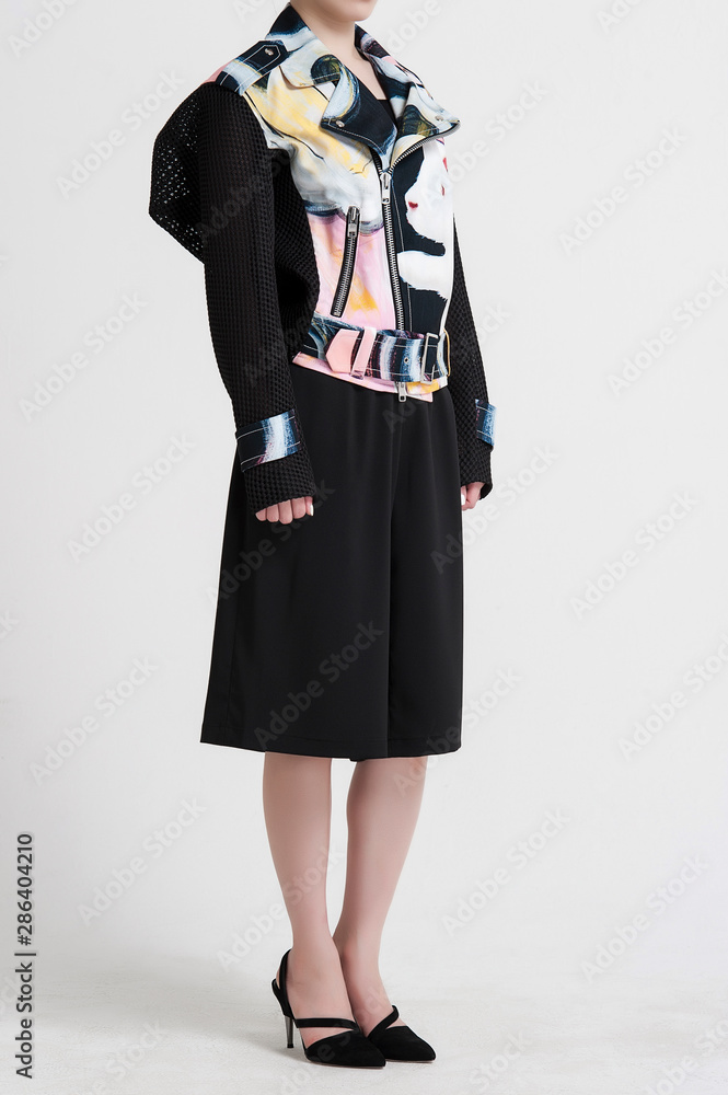 Asian woman wearing stylish black coat over white background