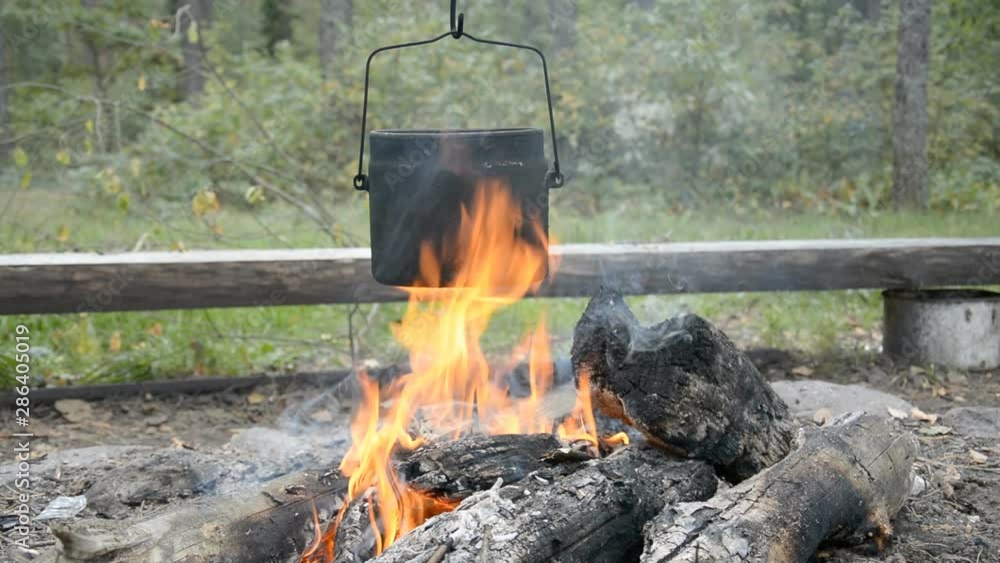 food camping, cooking on a campfire in the forest hd stock footage food camping, cooking on a campfire in the forest hd stock footage