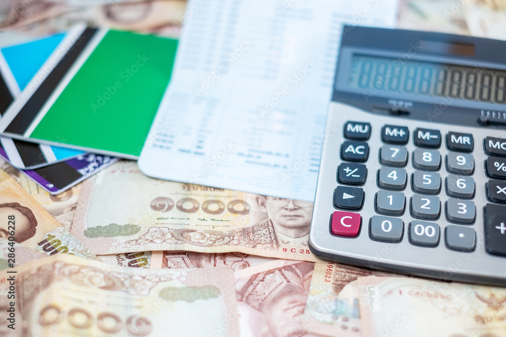 1000 Thai Baht banknote background with Calculator and book bank. business, investment, retirement planning, finance and Saving for the future concepts