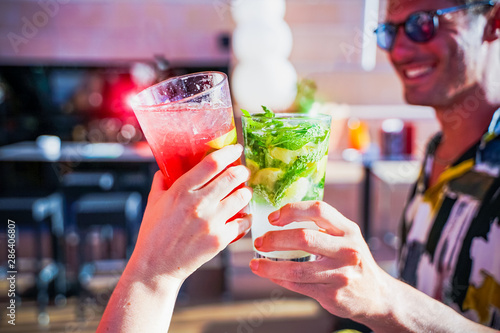 Photography Happy friends having a party drinking cocktails