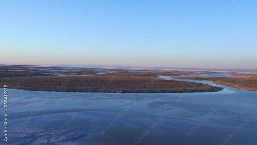 Aerial drone shooting of Salt Lake, a sunset scene with islands Aerial drone shooting of Salt Lake, a sunset scene with islands