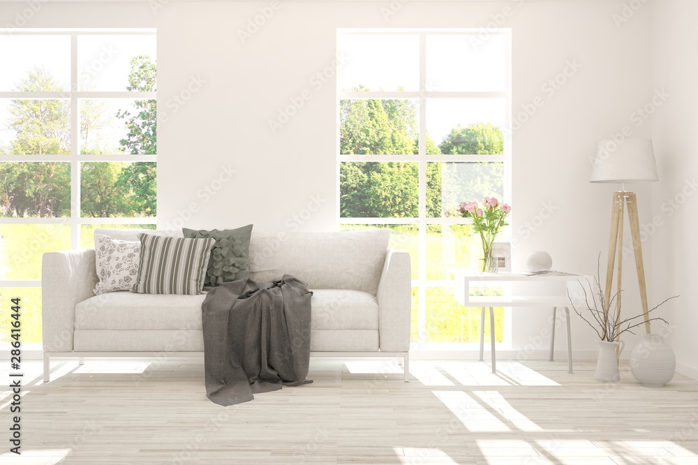 Stylish room in white color with sofa and summer landscape in window. Scandinavian interior design. 3D illustration Stylish room in white color with sofa and summer landscape in window. Scandinavian interior design. 3D illustration