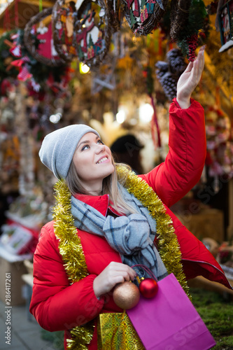 Girl shopping Christmas decorations