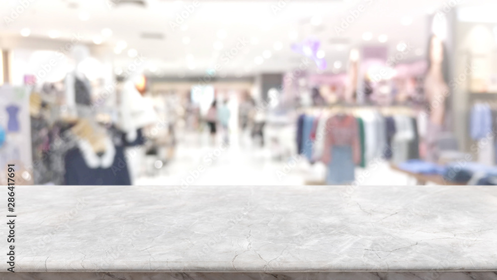 Empty white stone marble table top and blurred abstract interior from shopping mall background - can used for display or montage your products.