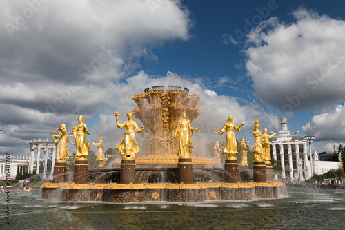 The Peoples Friendship Fountain in VDNKh park in Moscow. Amazing sunny view of the Soviet architecture, landmark of Moscow. Beautiful luxurious old fountain in summer.