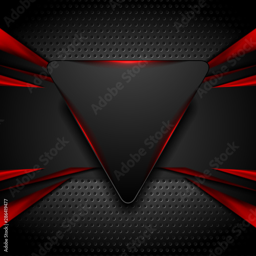 Abstract shiny hi-tech futuristic red and black background with neon light triangle. Dark perforated metallic texture. Vector geometric technology design