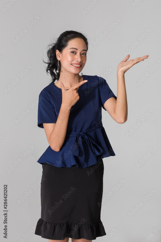 Woman pointing hands on right side.. Woman pointing hands on right side..