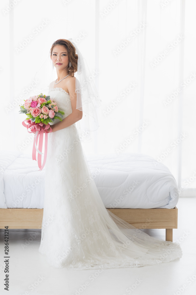 Bride is stands in beautiful white wedding dress.. Bride is stands in beautiful white wedding dress..
