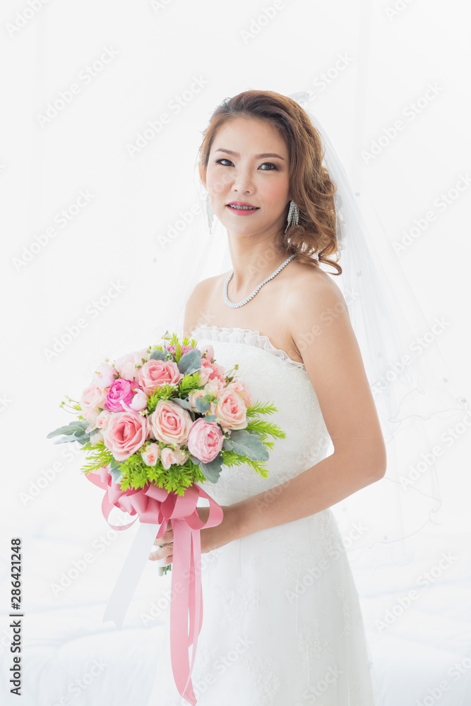 Bride is stands in beautiful white wedding dress.. Bride is stands in beautiful white wedding dress..