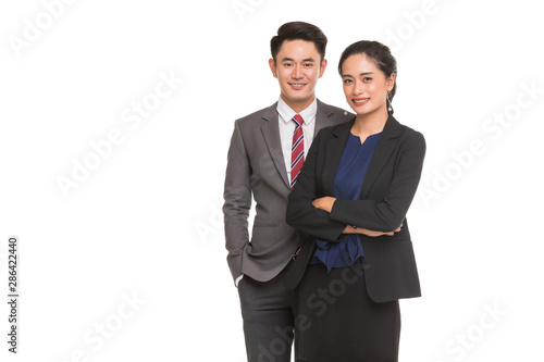 Two business people standing and posing..