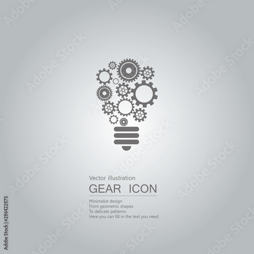 The idea of gears. The background is a gradient of gray.	