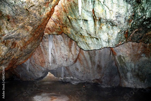 Cave The glacier from Scarisoara - Romania 02.Aug.2015 The Scărişoara cave or Scărişoara Glacier shelters the largest underground glacier in Romania photo