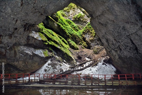 Cave The glacier from Scarisoara - Romania 02.Aug.2015 The Scărişoara cave or Scărişoara Glacier shelters the largest underground glacier in Romania photo