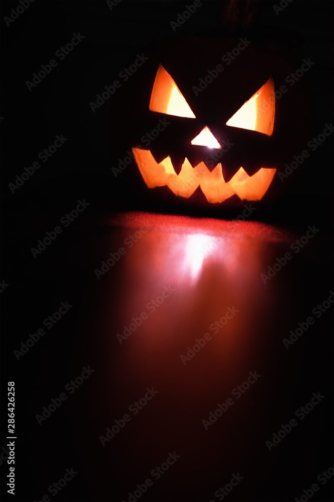 custom made wallpaper toronto digitalHalloween October holiday celebration symbol, scary pumpkin glowing with reflection, black background