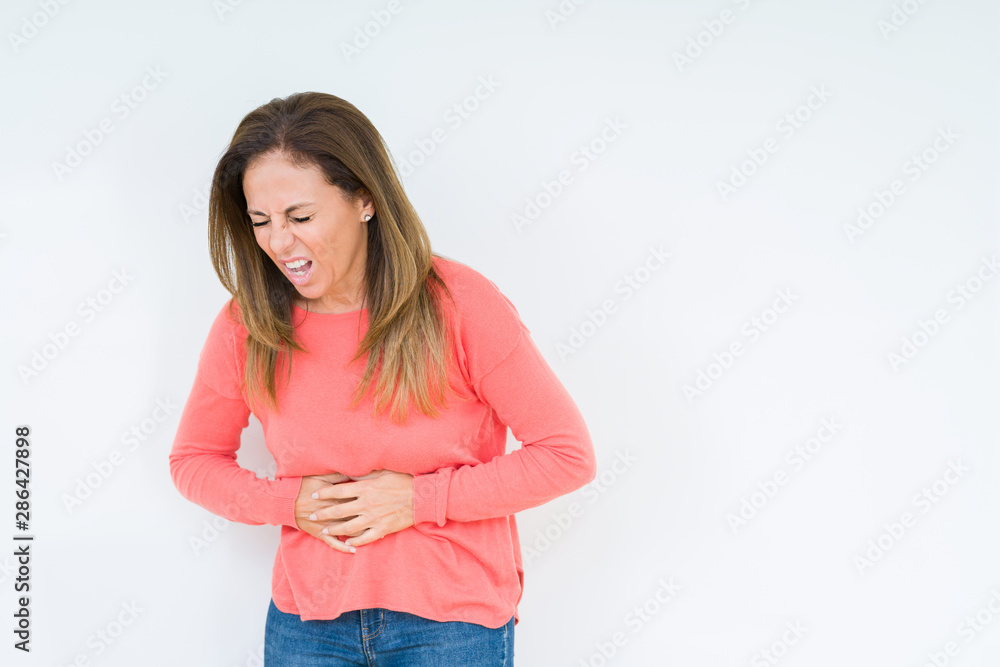 Beautiful middle age woman over isolated background with hand on stomach because indigestion, painful illness feeling unwell. Ache concept. Beautiful middle age woman over isolated background with hand on stomach because indigestion, painful illness feeling unwell. Ache concept.