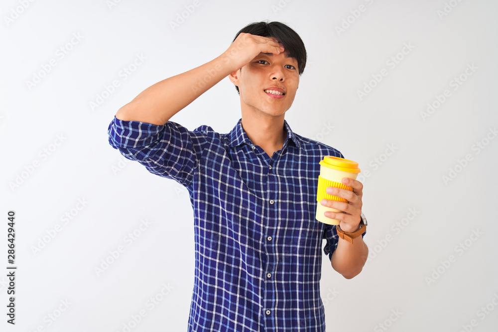 Young chinese man drinking take away coffee standing over isolated white background stressed with hand on head, shocked with shame and surprise face, angry and frustrated. Fear and upset for mistake. Young chinese man drinking take away coffee standing over isolated white background stressed with hand on head, shocked with shame and surprise face, angry and frustrated. Fear and upset for mistake.