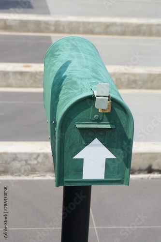 close up green mail box in garden photo