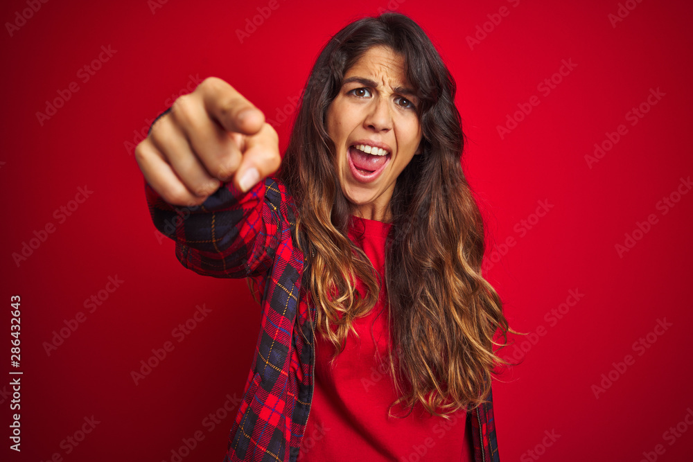 Young beautiful woman wearing casual jacket standing over red isolated background Posing funny and crazy with fingers on head as bunny ears, smiling cheerful Young beautiful woman wearing casual jacket standing over red isolated background Posing funny and crazy with fingers on head as bunny ears, smiling cheerful